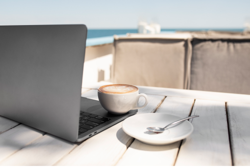 coffee-cup-and-laptop-at-seaside 1 (1)